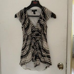 Silk sleeveless blouse with ruffles in front